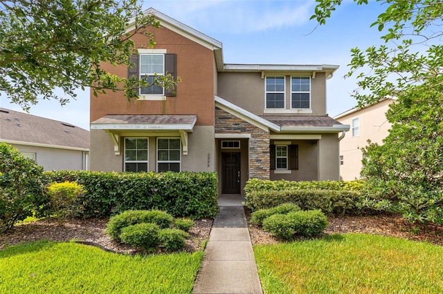 1978 J Lawson Blvd, Orlando, FL 32824 - view of front of house with stucco siding and stone siding