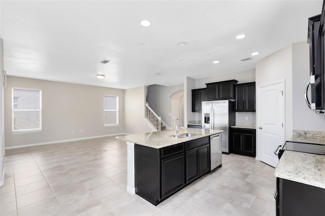 1978 J Lawson Blvd, Orlando, FL 32824 - kitchen featuring stainless steel appliances, dark cabinets, a sink, plenty of natural light, and recessed lighting