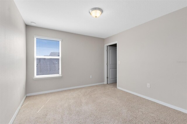 1978 J Lawson Blvd, Orlando, FL 32824 - unfurnished room featuring light carpet, baseboards, and a smoke detector
