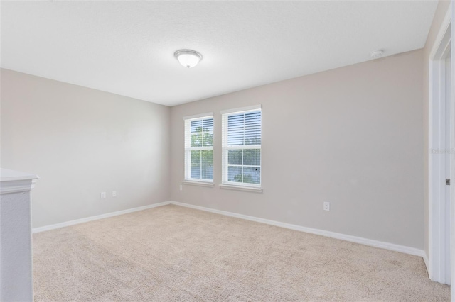 1978 J Lawson Blvd, Orlando, FL 32824 - carpeted spare room with baseboards and a smoke detector