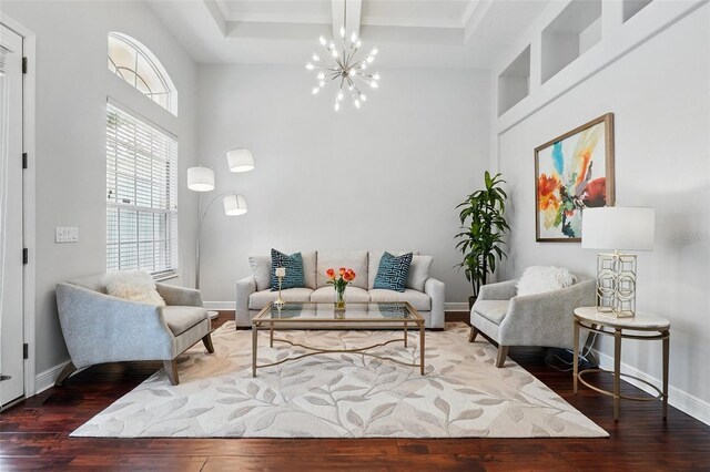 8418 Via Bella Notte, Orlando, FL 32836 - living room with a chandelier, wood-type flooring, a high ceiling, coffered ceiling, and baseboards