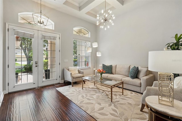 8418 Via Bella Notte, Orlando, FL 32836 - living area featuring a chandelier, coffered ceiling, french doors, wood-type flooring, and baseboards