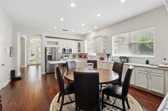 8418 Via Bella Notte, Orlando, FL 32836 - dining area featuring dark wood-style flooring, recessed lighting, and baseboards