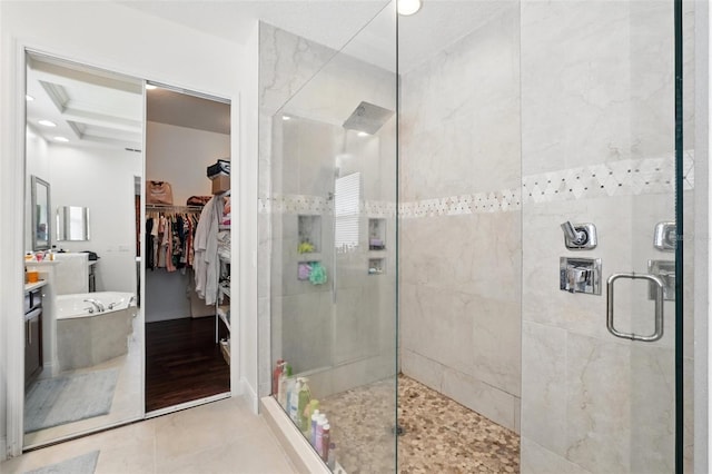8418 Via Bella Notte, Orlando, FL 32836 - full bathroom with vanity, a stall shower, a walk in closet, tile patterned flooring, and beamed ceiling