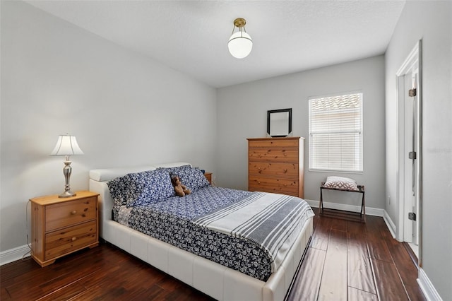 8418 Via Bella Notte, Orlando, FL 32836 - bedroom with dark wood-style flooring and baseboards