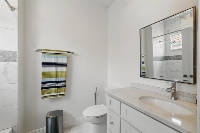 8418 Via Bella Notte, Orlando, FL 32836 - full bath with vanity, toilet, baseboards, marble look tiles, and a shower