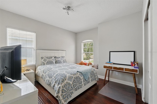 8418 Via Bella Notte, Orlando, FL 32836 - bedroom featuring dark wood-style flooring and baseboards