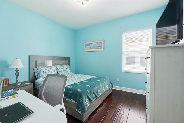 8418 Via Bella Notte, Orlando, FL 32836 - bedroom featuring baseboards and wood finished floors