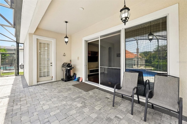 8418 Via Bella Notte, Orlando, FL 32836 - view of patio / terrace featuring glass enclosure, an outdoor pool, and area for grilling