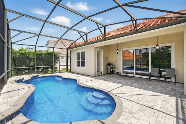 8418 Via Bella Notte, Orlando, FL 32836 - swimming pool featuring a patio, area for grilling, and a lanai