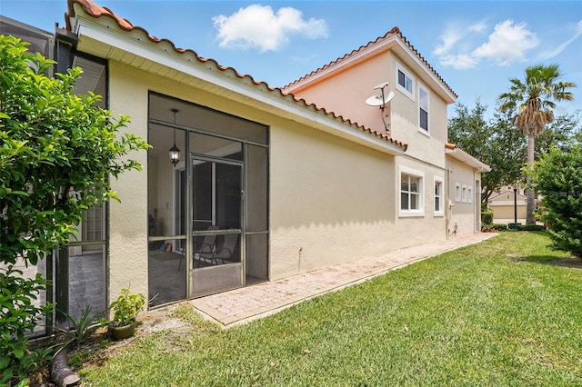 8418 Via Bella Notte, Orlando, FL 32836 - back of property featuring a lawn, stucco siding, and a tile roof