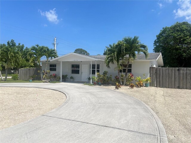 1894 SE Lafayette St, Stuart, FL 34997 - ranch-style house featuring curved driveway