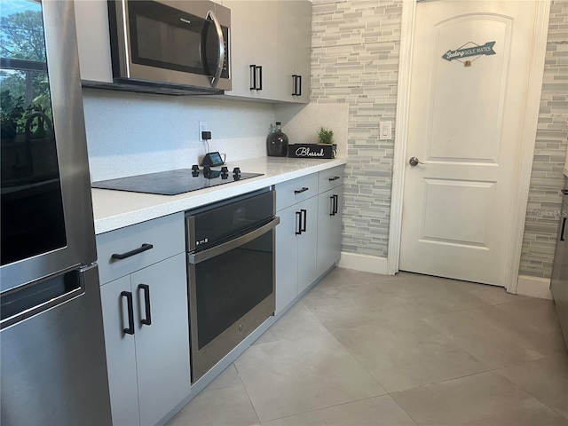 1894 SE Lafayette St, Stuart, FL 34997 - kitchen featuring stainless steel appliances, light countertops, and gray cabinetry