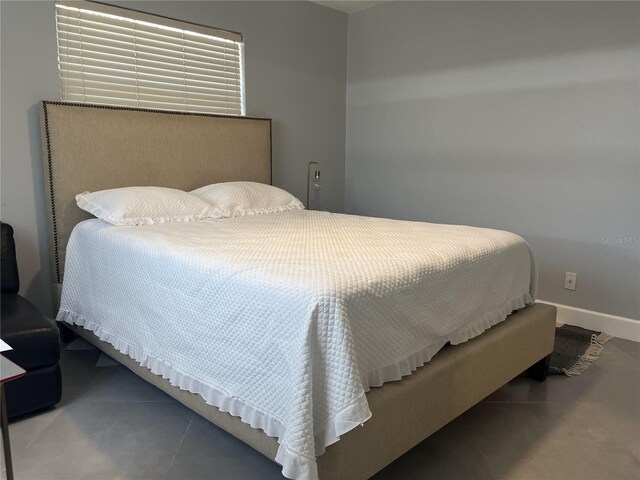 1894 SE Lafayette St, Stuart, FL 34997 - bedroom with tile patterned floors and baseboards