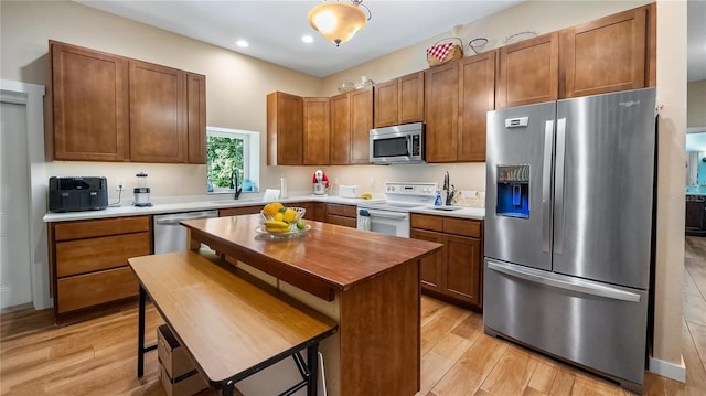287 Hilltop Dr, Longwood, FL 32750 - kitchen featuring stainless steel appliances, light wood finished floors, recessed lighting, brown cabinets, and wooden counters