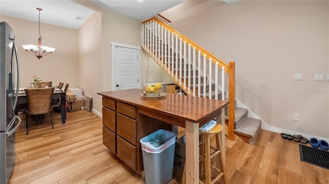 287 Hilltop Dr, Longwood, FL 32750 - stairs featuring a chandelier, wood finished floors, baseboards, and lofted ceiling