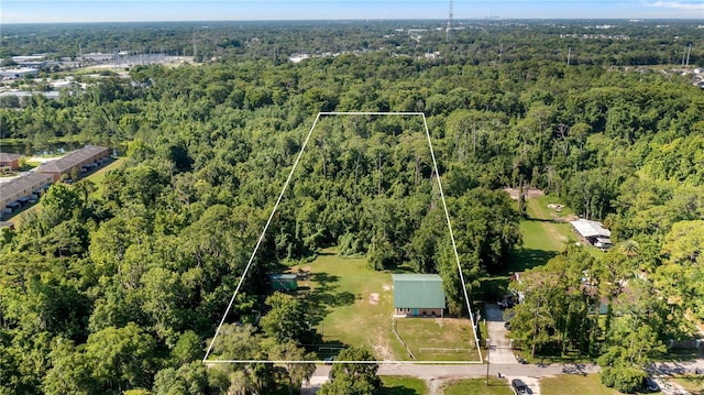 287 Hilltop Dr, Longwood, FL 32750 - aerial view of property and surrounding area with a forest and property parcel outlined