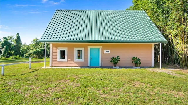 287 Hilltop Dr, Longwood, FL 32750 - view of front of house with metal roof and a front yard