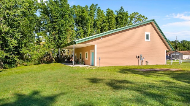 287 Hilltop Dr, Longwood, FL 32750 - view of side of home with a patio and a lawn