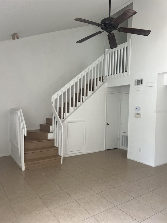 460 Sand Lime Rd, Winter Garden, FL 34787 - unfurnished living room with a ceiling fan, stairway, a high ceiling, and light tile patterned floors