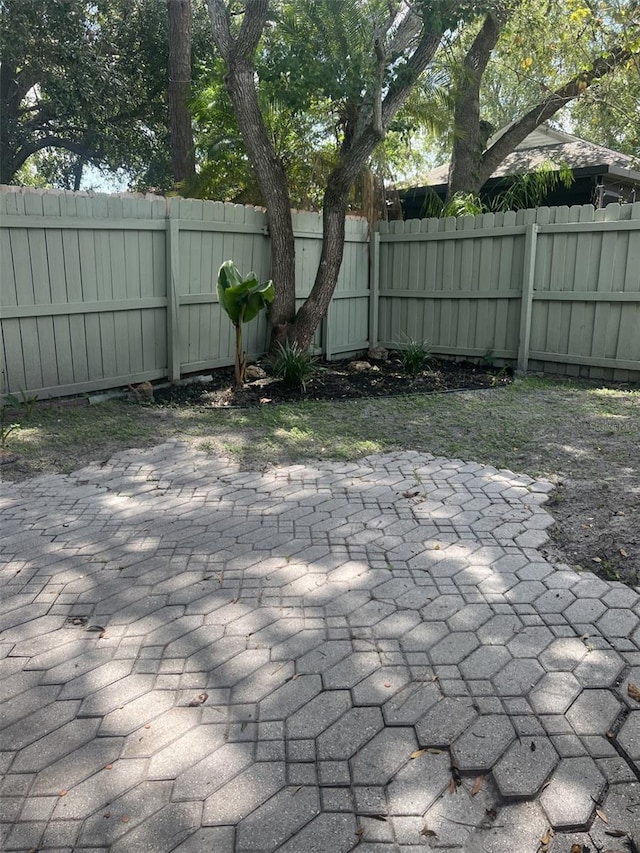 460 Sand Lime Rd, Winter Garden, FL 34787 - fenced backyard with a patio