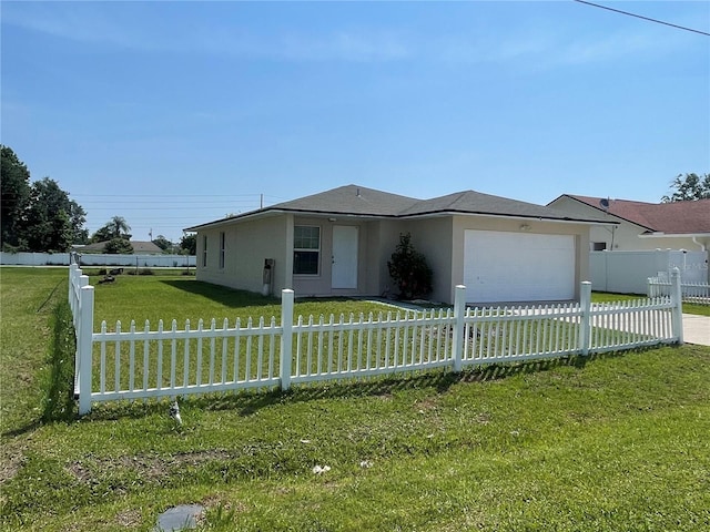 909 San Paulo Way, Kissimmee, FL 34758 - view of front of house featuring an attached garage, driveway, and stucco siding