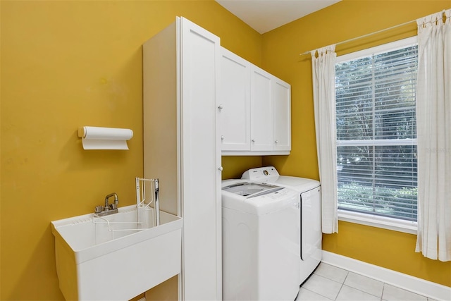 914 Elysium Blvd, Mount Dora, FL 32757 - washroom with washing machine and clothes dryer, light tile patterned flooring, and cabinet space