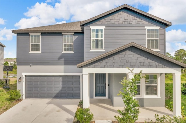 2210 Derwent Dr, Davenport, FL 33896 - view of front of home with driveway, an attached garage, and stucco siding