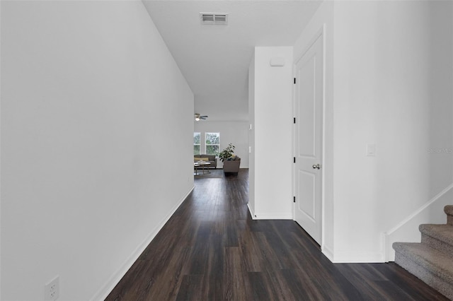 2210 Derwent Dr, Davenport, FL 33896 - hallway with wood finished floors, stairway, and baseboards