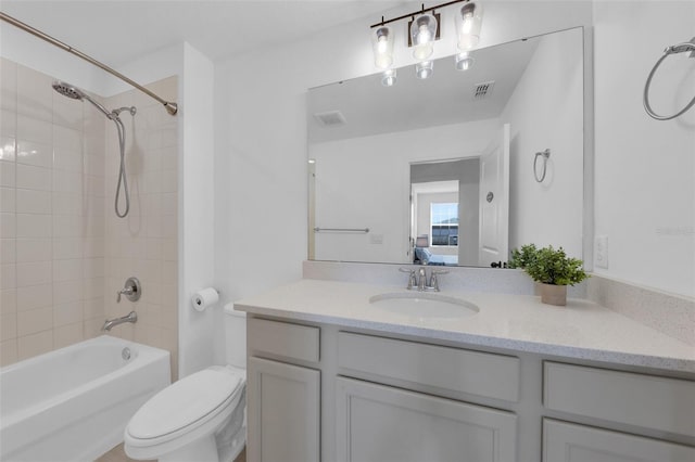 2210 Derwent Dr, Davenport, FL 33896 - bathroom featuring vanity, bathtub / shower combination, and toilet