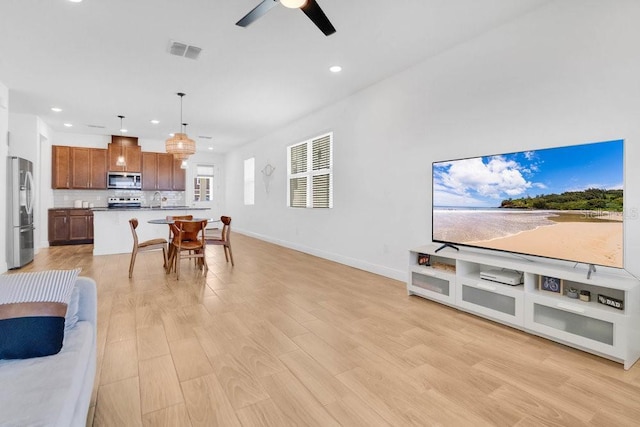 3280 Canna Lily Pl, Clermont, FL 34711 - living area with recessed lighting, baseboards, light wood finished floors, and ceiling fan