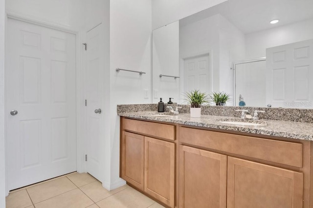 3280 Canna Lily Pl, Clermont, FL 34711 - full bath featuring double vanity, tile patterned flooring, and a shower with door