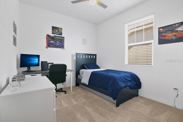 3280 Canna Lily Pl, Clermont, FL 34711 - bedroom with light carpet, a desk, a ceiling fan, and baseboards