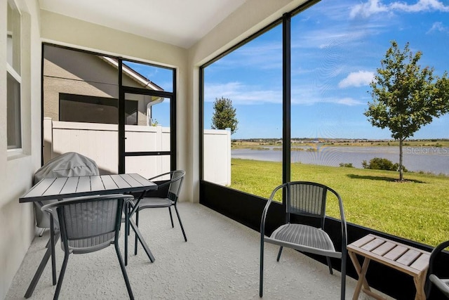 3280 Canna Lily Pl, Clermont, FL 34711 - sunroom / solarium featuring a water view