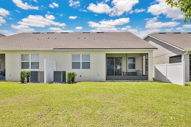 3280 Canna Lily Pl, Clermont, FL 34711 - rear view of property with central AC unit, a sunroom, stucco siding, and roof with shingles