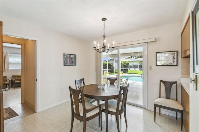 620 Marshall St, Altamonte Springs, FL 32701 - dining area with a chandelier, plenty of natural light, and baseboards