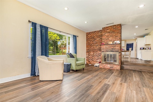 660 6th St, Daytona Beach, FL 32117 - living area with wood finished floors, recessed lighting, a fireplace, and baseboards