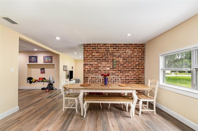 660 6th St, Daytona Beach, FL 32117 - dining space with wood finished floors, baseboards, and recessed lighting