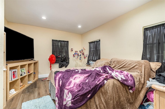 660 6th St, Daytona Beach, FL 32117 - bedroom with wood finished floors, recessed lighting, and baseboards