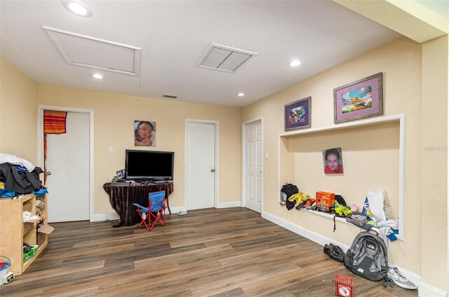 660 6th St, Daytona Beach, FL 32117 - recreation room with wood finished floors, attic access, recessed lighting, and baseboards