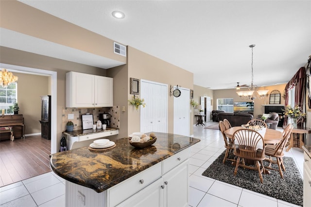 2214 Westbourne Dr, Oviedo, FL 32765 - kitchen featuring a chandelier, open floor plan, tile patterned floors, plenty of natural light, and recessed lighting