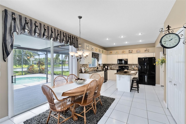 2214 Westbourne Dr, Oviedo, FL 32765 - dining room with light tile patterned floors, recessed lighting, a chandelier, and baseboards