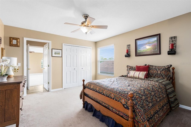 2214 Westbourne Dr, Oviedo, FL 32765 - bedroom with light colored carpet, baseboards, a closet, and ceiling fan