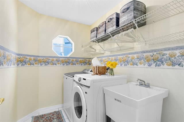 2214 Westbourne Dr, Oviedo, FL 32765 - laundry area featuring washer and clothes dryer, baseboards, and tile patterned floors