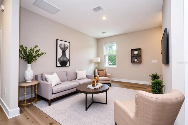1331 19th St, Orlando, FL 32805 - living room featuring light wood-type flooring, baseboards, and recessed lighting
