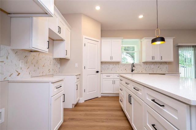 1331 19th St, Orlando, FL 32805 - kitchen with plenty of natural light, recessed lighting, light wood-style flooring, pendant lighting, and decorative backsplash