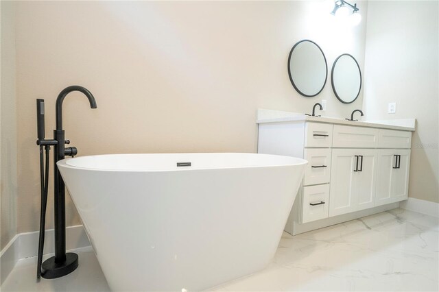 1331 19th St, Orlando, FL 32805 - bathroom featuring double vanity, a freestanding bath, baseboards, and marble finish floors