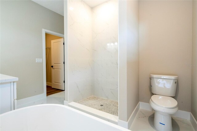 1331 19th St, Orlando, FL 32805 - full bathroom featuring toilet, baseboards, a freestanding tub, and a stall shower