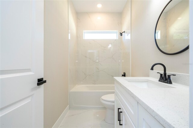 1331 19th St, Orlando, FL 32805 - bathroom with vanity, toilet, shower / bathtub combination, marble finish flooring, and baseboards