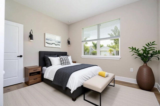 1331 19th St, Orlando, FL 32805 - bedroom with light wood-style floors and baseboards